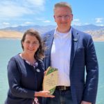 Assistant Secretary of the Interior Tanya Trujillo presents Program Manager Don Portz with an Environmental Achievement Award