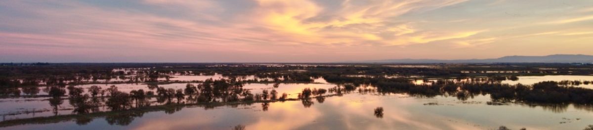 Flood flows at sunset on the San Joaquin River