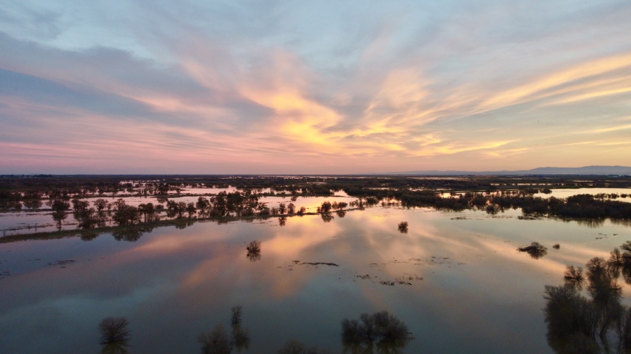 Flood flows at sunset on the San Joaquin River